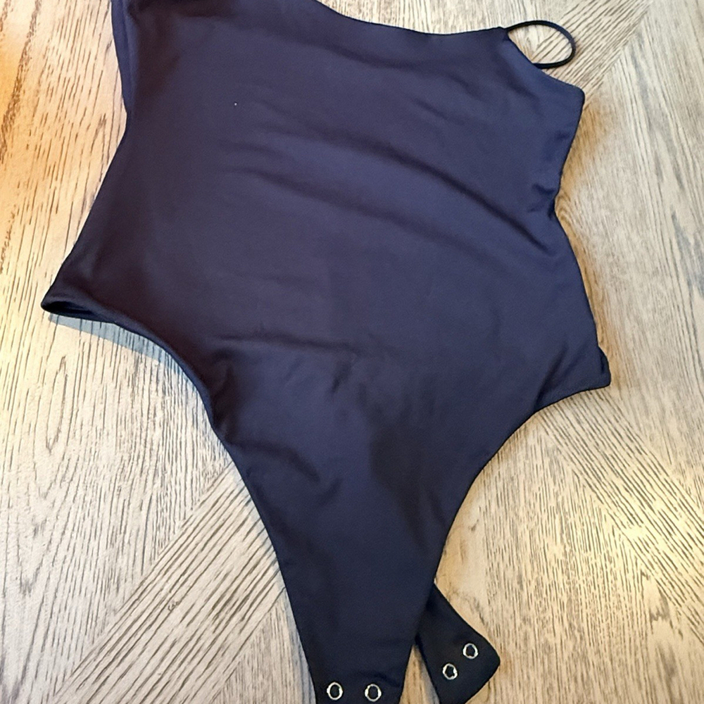 Women NWOT \"Anthropologie\". black spaghetti strap body suit. Size M